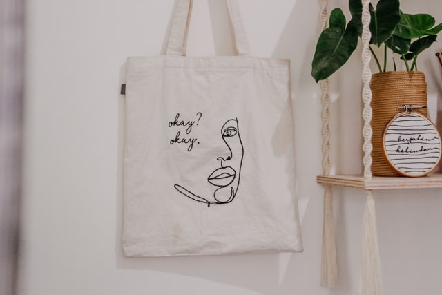 A tote bag hanging on a wall